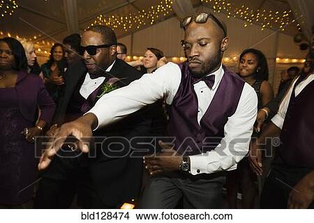Groom and groomsman dancing at reception View Large Photo Image Picture - Groom and groomsman dancing at reception. Fotosearch