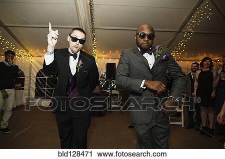 Groom and groomsman dancing at reception View Large Photo Image Stock Image - Groom and groomsman dancing at reception. Fotosearch