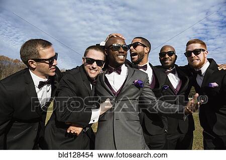Picture - Groom and groomsmen posing for wedding pictures. Fotosearch