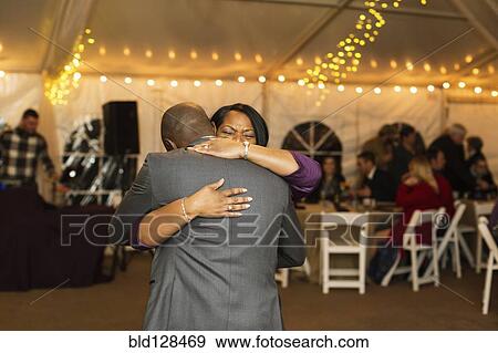 Stock Photo - Groom dancing with mother at reception. Fotosearch