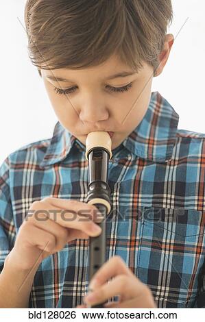 Hispanic boy practicing recorder View Large Photo Image Stock Photograph - Hispanic boy practicing recorder. Fotosearch