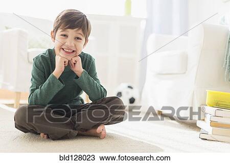 Hispanic boy smiling in living room View Large Photo Image Stock Image - Hispanic boy smiling in living room. Fotosearch