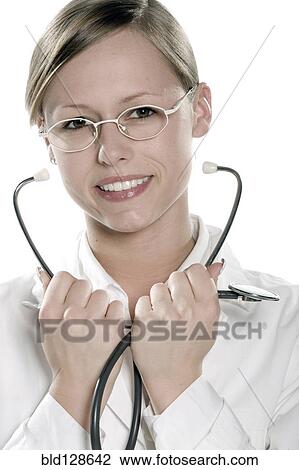 Hispanic doctor holding stethoscope View Large Photo Image Stock Image - Hispanic doctor holding stethoscope. Fotosearch