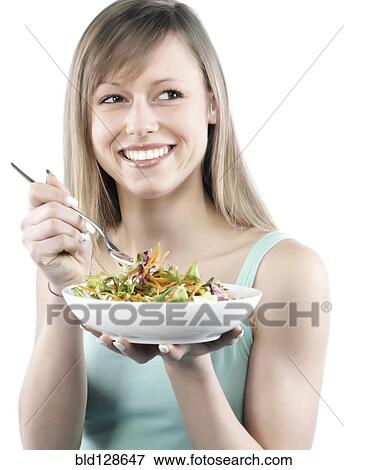 Hispanic woman eating salad View Large Photo Image Stock Photo - Hispanic woman eating salad. Fotosearch