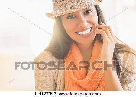 Hispanic woman in fedora and scarf View Large Photo Image Stock Photo - Hispanic woman in fedora and scarf. Fotosearch