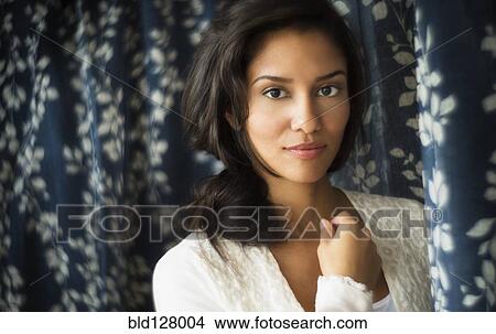 Hispanic woman smiling indoors View Large Photo Image Picture - Hispanic woman smiling indoors. Fotosearch