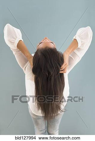 Hispanic woman with long hair leaning back View Large Photo Image Picture - Hispanic woman with long hair leaning back. Fotosearch
