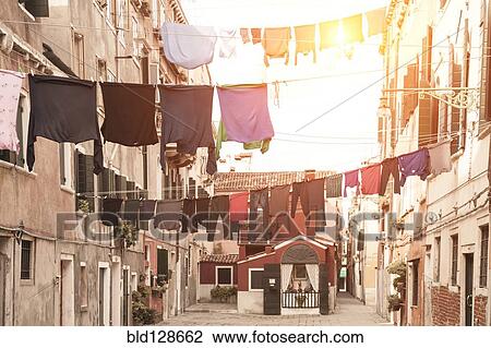 Laundry hanging from apartment buildings View Large Photo Image Stock Image - Laundry hanging from apartment buildings. Fotosearch