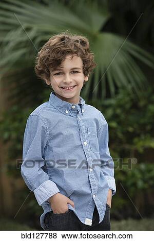 Stock Photo - Mixed race boy smiling outdoors. Fotosearch