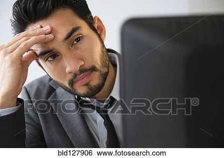 Mixed race businessman working in office View Large Photo Image Stock Photograph - Mixed race businessman working in office. Fotosearch