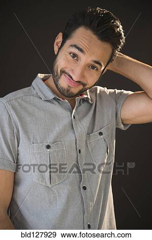 Stock Photo - Mixed race man smiling. Fotosearch