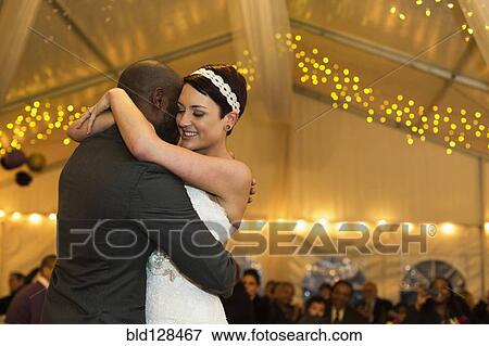 Stock Photo - Newlywed couple dancing at reception. Fotosearch