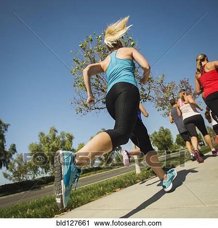 People jogging together outdoors View Large Photo Image Stock Image - People jogging together outdoors. Fotosearch