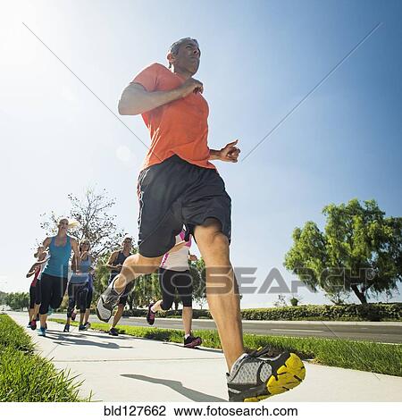 People jogging together outdoors View Large Photo Image Stock Image - People jogging together outdoors. Fotosearch