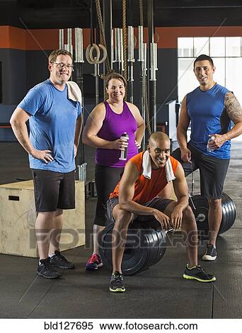 People resting together in gym View Large Photo Image Stock Photography - People resting together in gym. Fotosearch