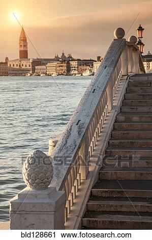 Railing on steps by canal, Venice, Veneto, Italy View Large Photo Image Stock Image - Railing on steps by canal, Venice, Veneto, Italy. Fotosearch