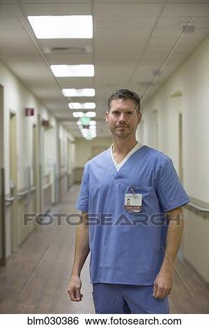 Caucasian doctor in hospital corridor View Large Photo Image Stock Photograph - Caucasian doctor in hospital corridor. Fotosearch