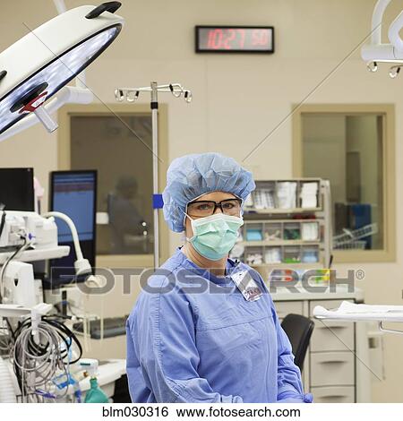 Stock Photograph - Caucasian surgeon sitting in operating room. Fotosearch