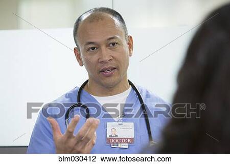 Doctor talking in hospital View Large Photo Image Stock Image - Doctor talking in hospital. Fotosearch