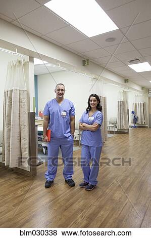 Doctors smiling in hospital View Large Photo Image Stock Photo - Doctors smiling in hospital. Fotosearch