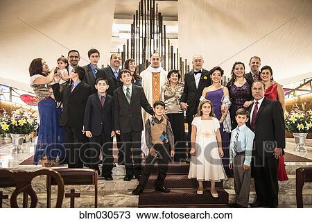 Family posing at wedding in church View Large Photo Image Stock Image - Family posing at wedding in church. Fotosearch