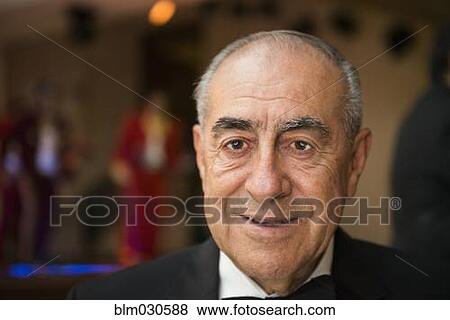 Hispanic man smiling at wedding reception View Large Photo Image Stock Photo - Hispanic man smiling at wedding reception. Fotosearch