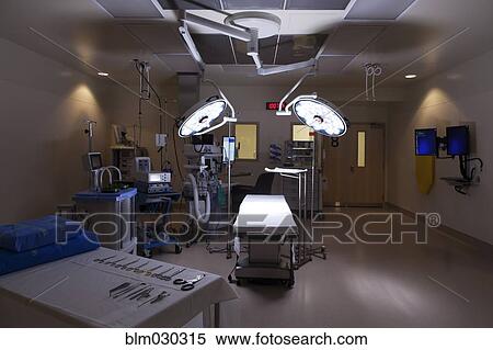 Stock Photography - Lights and table in empty operating room. Fotosearch