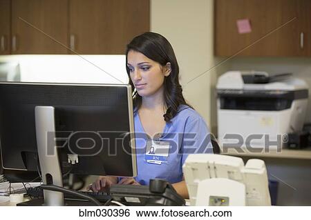 Mixed race nurse working in hospital View Large Photo Image Stock Photograph - Mixed race nurse working in hospital. Fotosearch