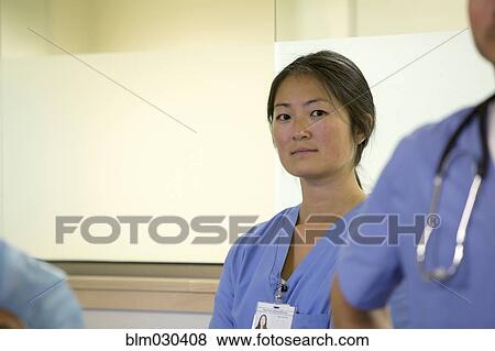 Stock Photo - Nurse standing in hospital room. Fotosearch