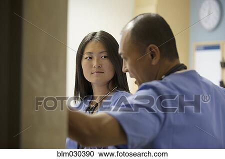 Nurses talking in hospital View Large Photo Image Stock Image - Nurses talking in hospital. Fotosearch