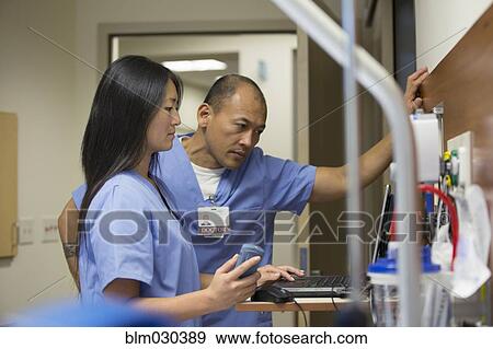 Nurses working with hospital equipment View Large Photo Image Stock Photo - Nurses working with hospital equipment. Fotosearch