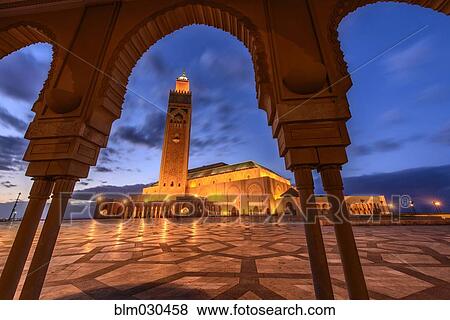 Stock Photo - Ornate Hassan II Mosque lit up at night, Casablanca, Morocco. Fotosearch