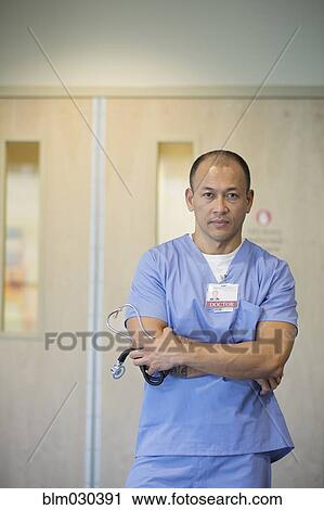 Pacific Islander doctor standing in hospital View Large Photo Image Stock Image - Pacific Islander doctor standing in hospital. Fotosearch