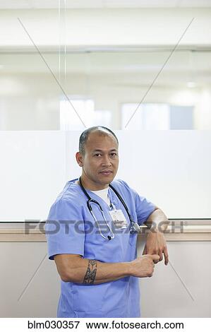 Pacific Islander doctor standing in hospital corridor View Large Photo Image Stock Photo - Pacific Islander doctor standing in hospital corridor. Fotosearch