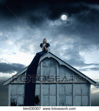 Pacific Islander woman sitting on rooftop View Large Photo Image Stock Photo - Pacific Islander woman sitting on rooftop. Fotosearch