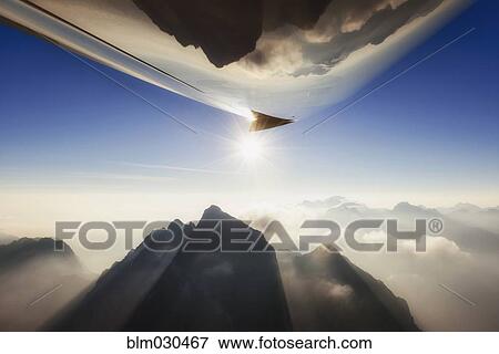 Rocky landscape reflected in belly of airplane, Julian Alps, Gorenjska, Slovenia View Large Photo Image Stock Photo - Rocky landscape reflected in belly of airplane, Julian Alps, Gorenjska, Slovenia. Fotosearch