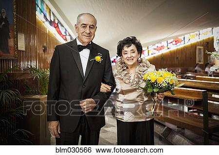 Stock Photograph - Senior couple smiling at wedding. Fotosearch