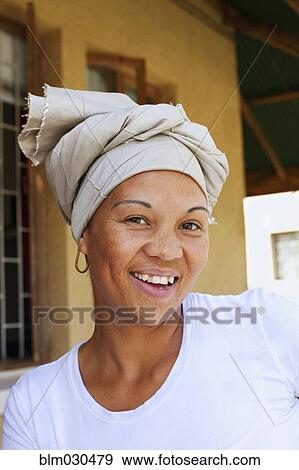 Stock Photo - Smiling mixed race woman wearing turban. Fotosearch