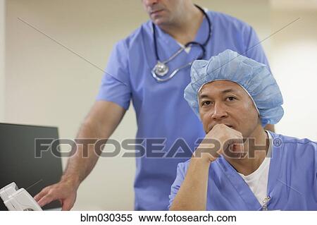 Stock Photography - Surgeon wearing surgical cap in hospital. Fotosearch