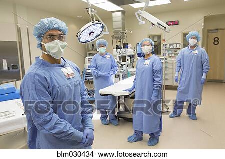 Picture - Surgeons in operating room in hospital. Fotosearch