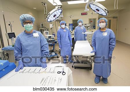 Surgeons in operating room in hospital View Large Photo Image Stock Photography - Surgeons in operating room in hospital. Fotosearch