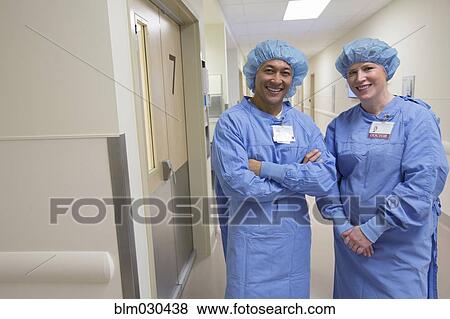 Stock Photo - Surgeons smiling in hospital corridor. Fotosearch