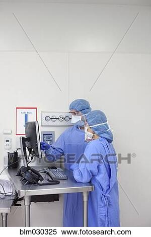 Surgeons working in operating room View Large Photo Image Stock Photography - Surgeons working in operating room. Fotosearch