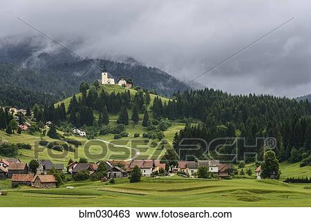Village at base of rolling landscape, Retje, Notranjska, Slovenia View Large Photo Image Stock Image - Village at base of rolling landscape, Retje, Notranjska, Slovenia. Fotosearch