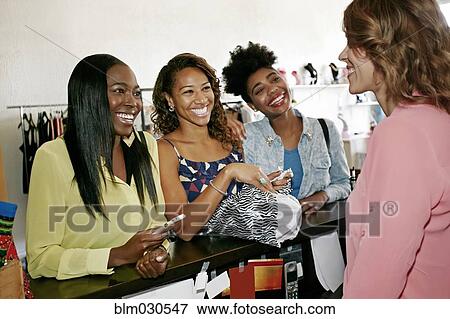 Stock Photo - Women shopping in store. Fotosearch