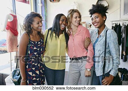 Women shopping together in store View Large Photo Image Stock Image - Women shopping together in store. Fotosearch