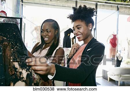 Stock Photo - Women shopping together in store. Fotosearch