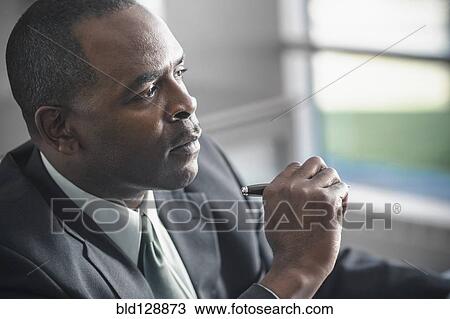 Stock Image - African American businessman in office. Fotosearch