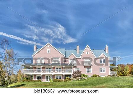 Bed and breakfast overlooking sunny yard View Large Photo Image Stock Photo - Bed and breakfast overlooking sunny yard. Fotosearch
