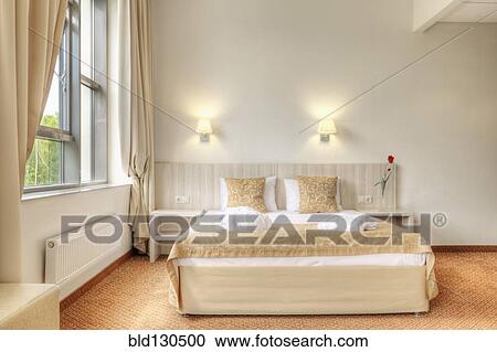 Bed and curtains in hotel room View Large Photo Image Stock Image - Bed and curtains in hotel room. Fotosearch
